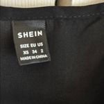 SheIn Super cute!  Black Plunge Neck Sleeveless Mini Dress Photo 1