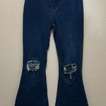 Trendy Dark Blue Flare Jeans with Ripped Knees Size M Photo 0