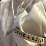 Alice + Olivia Onita Pleated Waist Tie Jumpsuit In White Photo 4