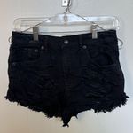 American Eagle Selling a pair of Vintage Hi-Rise Festival shorts in a size 4. They are black, stretchy, and have a distressed look. Perfect for a casual, edgy style! Photo 0