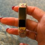 Fitbit barely used. As is. No idea what model. Cute band purchased separately Photo 0