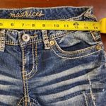 Maurice's Maurice Distressed Blue Jean Shorts are a size 1/2. Photo 3