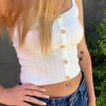 Off white stretchy knit tank with bow buttons ๐ Photo 1