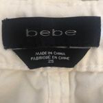 Bebe  white jeans with chevron side embroidery‎ Photo 2