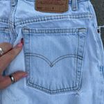 Levi's 90s Levi’s 550 Relaxed Fit Tapered Leg Ladies 10 REG Light Blue Jeans worn in Photo 3