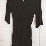 The Comfy Black long sleeve open back romper Photo 1