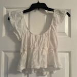 white ruffle shirt Photo 1
