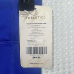 Fabletics  Trinity Motion365 Mid-Rise Leggings in Electric Violet/Powder Blue Photo 2