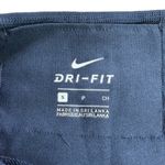 Nike  Women’s Athletic Mid-Rise Logo Front Capri Tights Photo 3