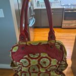 Petunia Pickle Bottom Diaper Bag. Red and Yellow Women's Diaper Bag Photo 1