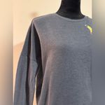 Pokémon EUC Pokemon Gray Sweater with Pokemon Patches size medium Photo 1