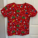 Disney Christmas Print Women’s Scrub Top in Red Photo 2