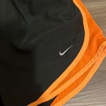 Nike  Dri-Fit Women's Black and Orange Running Shorts Photo 2