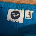 Roxy Turquoise cropped top with lacy pattern. With adjustable straps. Size L, . Photo 3