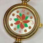 Women’s Poinsettia Quartz analog watch gold tone 25mm bracelet Size 7” running Photo 2