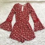 Hollister Women’s long sleeve romper shorts in all over floral red size Medium Photo 1