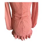 EXPRESS -FAUX WRAP MINI DRESS-SIZE XS V neck, faux wrap front, long sheer sleeves, ruched skirt with ruffles down the side, tiered ruffle hem, metallic fit fabric, fully lined except for sleeves, excellent condition, like new Measurements: Bust: armpit to armpit 16 1/2 inches Waist: side to side 13 inches Length: shoulder seam to bottom 32 inches Photo 11