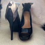 Elle bow on back of the black faux leather platform heels Size 7 M stilettos. Photo 15