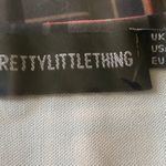 Pretty Little Thing NWOT--PLAID TOP-SIZE Nude and blue check top, long sleeves, plunge neck, tie at waist, brand new, size 2, 95% polyester 5% elastane Measurements: Bust: armpit to armpit Length: shoulder seam to bottom 21 inches Photo 4