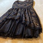 B. Wear Black Lace Mini Dress Photo 1