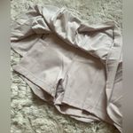Aritzia  TnAction light lavender tennis mini pleated skort size S Photo 1