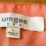 Umgee dress, size Large. Sleeveless dress with cutout design at the hem. Photo 3