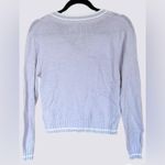 Divided Soft, cable-knit, v-neck sweater with long sleeves. Light purple. Size Small Photo 1
