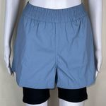 We Wore What  Windbreaker Biker Short in Dusty Blue Photo 1