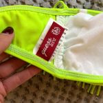 Guess Lightly used  neon green fringe bathing suit top size medium Photo 2