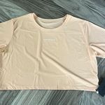 Alphalete  Signature Mesh Short Sleeve Crop Top in Cheeky Coral Size XL Photo 3