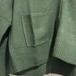 Calvin Klein NWT  Jeans Women's Cutout V Neck Cardigan Green Size  S/P. Photo 12