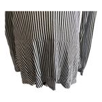 Michael Kors beautiful tunic top, black and white stripes. Long sleeves, lightweight, two tier ruffle bottom, excellent condition, size medium Measurements: Bust: armpit to armpit 20 inches Length: shoulder seam to bottom 29 inches Photo 2