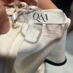 Q&A  beige and black flowy top Photo 5