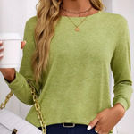 Elevate your wardrobe with this stylish green long sleeve top. Perfect for any occasion, it offers comfort and elegance. NWOT Polyester/Rayon/spandex blend Pit to pit 18” approx laying flat Size M Photo 0