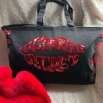 Victoria's Secret  Black Tote Traveler with Red Sequins shaped like lips Photo 0