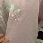 Reebok  Women's Soft Pink Tee  Chic and comfy short sleeve tee. Ideal for everyday wear.Small stains shown.  Photo 8
