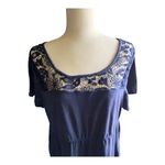 Torrid NWOT- Beautiful navy blue babydoll top with lace neckline and lace hem, excellent condition, size 2x Measurements: Bust: armpit to armpit 22 inches Length: shoulder seam to bottom 28 inches Photo 2