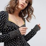 Free People Black Floral Kissin Kate Contrast Trim Long Sleeve Henley Top Photo 0