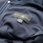 Betsy and Adam . Christine Scuba Crepe Ruffled Bow Gown. Photo 2