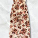 White Romper with a Long Train, Red Flower Prints, and Zipper in the Back Size M Photo 1