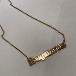 Sagittarius Gold Necklace. Photo 1
