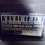 Skechers  Men's Black and White Slip-On Loafers Photo 8