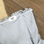 Light blue ruffled tiered smocked strapless romper Photo 2