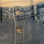 Indigo Rein  medium/light was distressed button front denim mini skirt. Photo 3