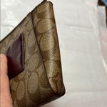 Coach  Brown Clutch with Monogram Pattern and Zipper Closure Photo 12