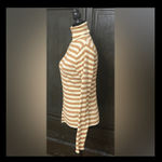 7 Love metallic brown & cream turtleneck sweater- Size Large***refer to measurements for size. Gently Warn and excellent condition. Measurements approximately from armpit to armpit 15” not fully stretched out x 23” long. None smoking home. Priced at as is condition. Don’t like my price make a reasonable offer! And thank you for checking my closet! Photo 1