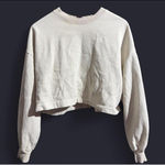 Under Armour Calvin Klein black faux-leather blouse in great condition. Features a gathered neckline, subtle puff sleeves, and a soft flexible vegan-leather material. Keyhole button closure in back. Chic, modern, and perfect for going out, work, or fall/winter layering. Photo 2