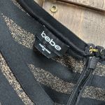 Bebe  Black and Gold Off Shoulder Bandage Midi Dress Photo 3