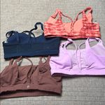 Athleta Lot of 4  sport bras. All size M Photo 1