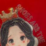 Charming red woman shirt featuring a cute princess design. Perfect for adding a touch of magic to any outfit. Size M Photo 1
